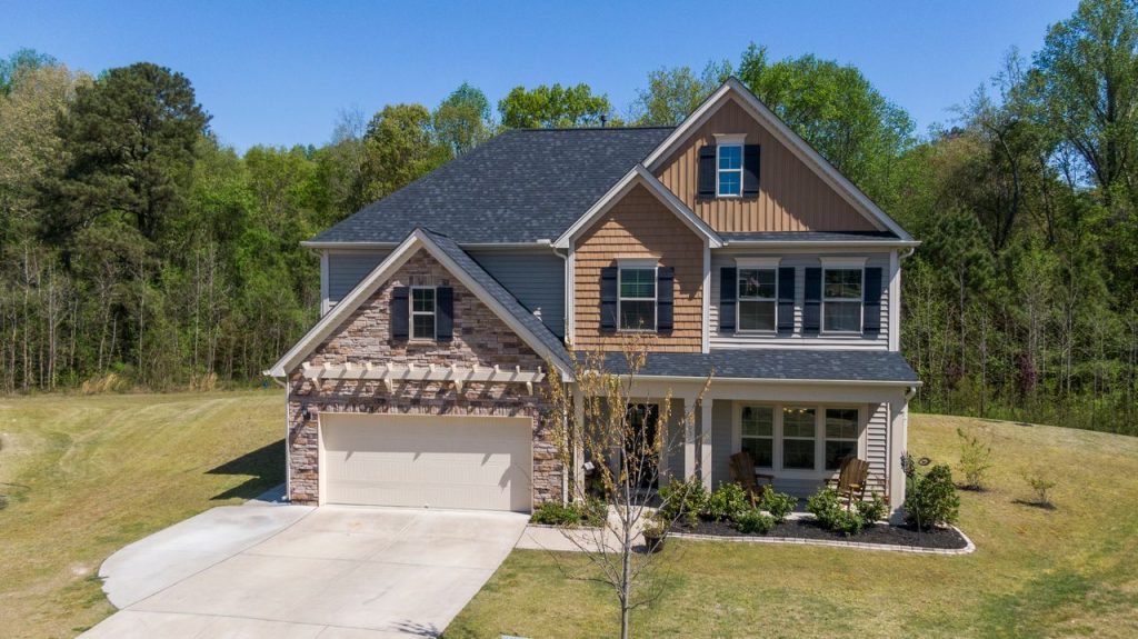 A beautiful suburban home surrounded by lush greenery, perfect for family living.